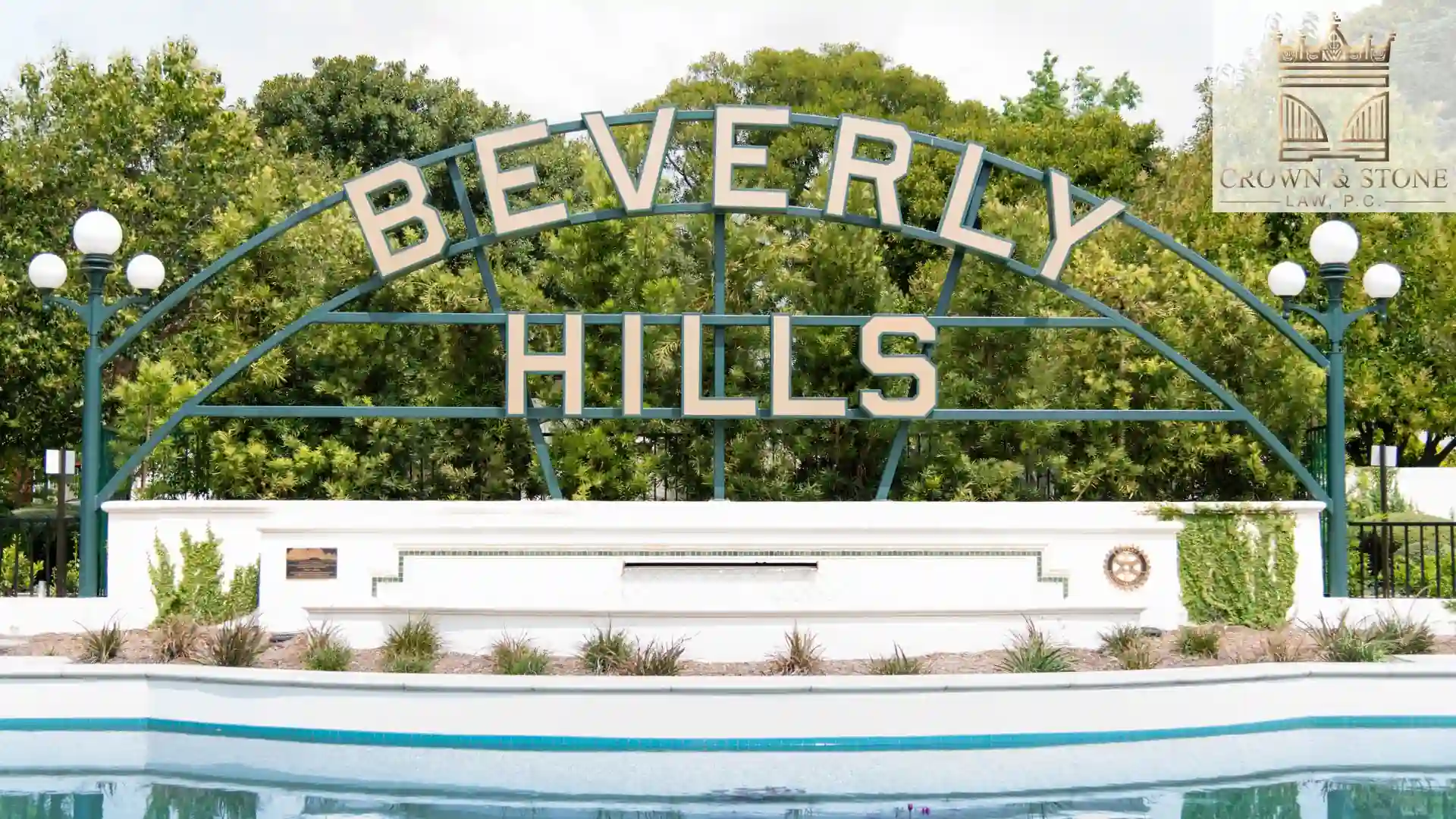 Beverly Hills sign with trees background