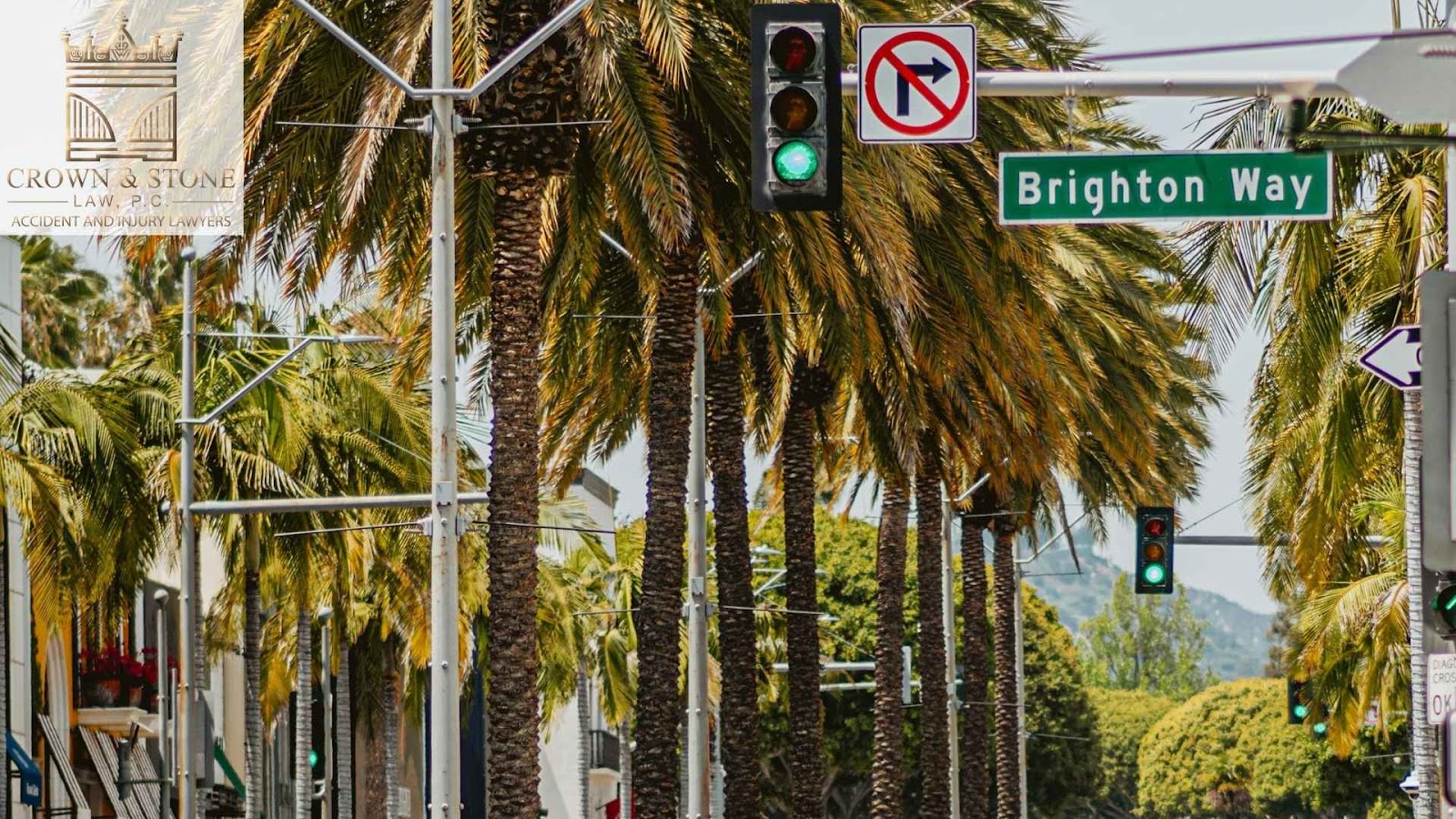 Vibrant street in brighton way, beverley hills, with exotic palm trees and a stop light, where a truck accident can occur.