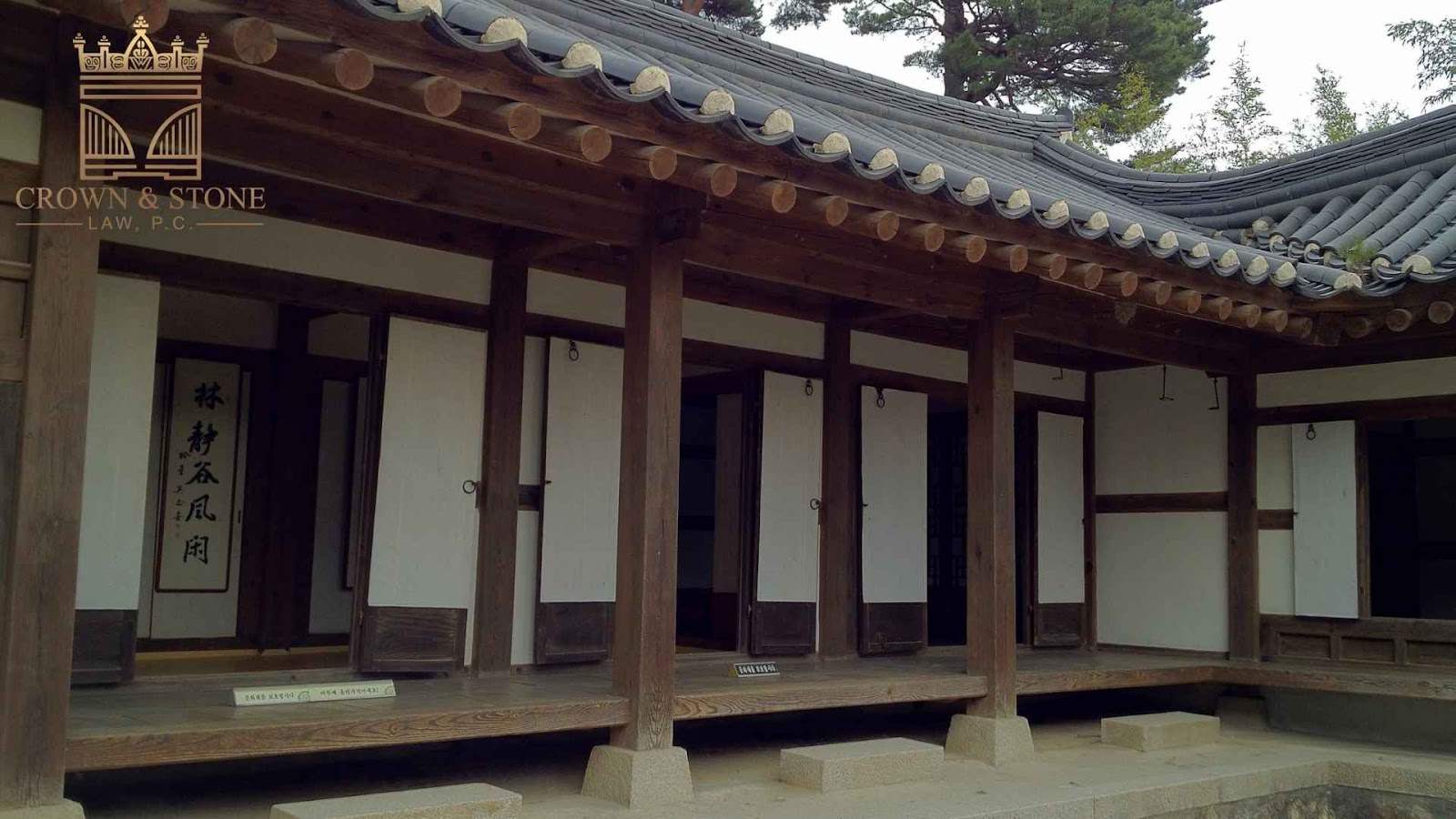 Traditional Korean restaurant with wooden pillars and doors.