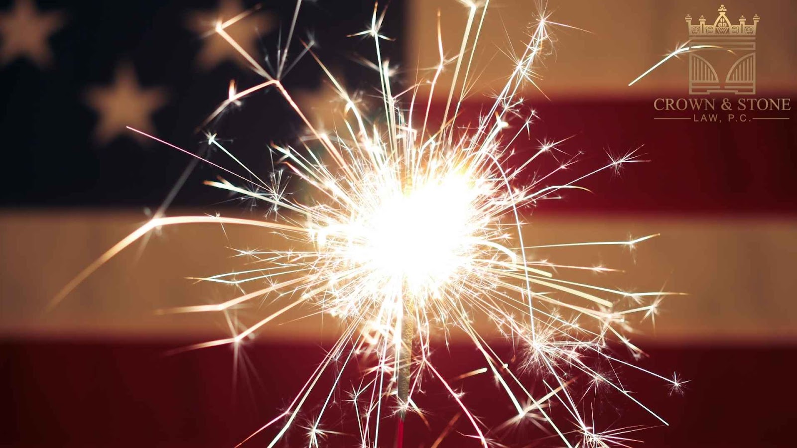 Sparkler with American flag background.