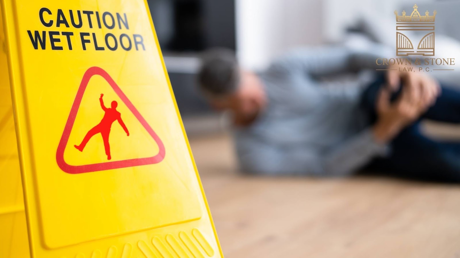 Caution wet floor sign with injured person