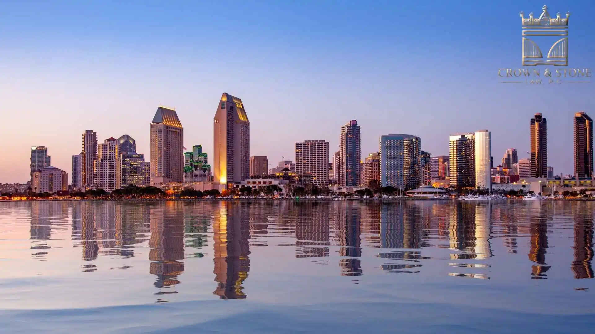 the skyline of san diego, California is reflected in the water, where Motorcycle accidents often occur.