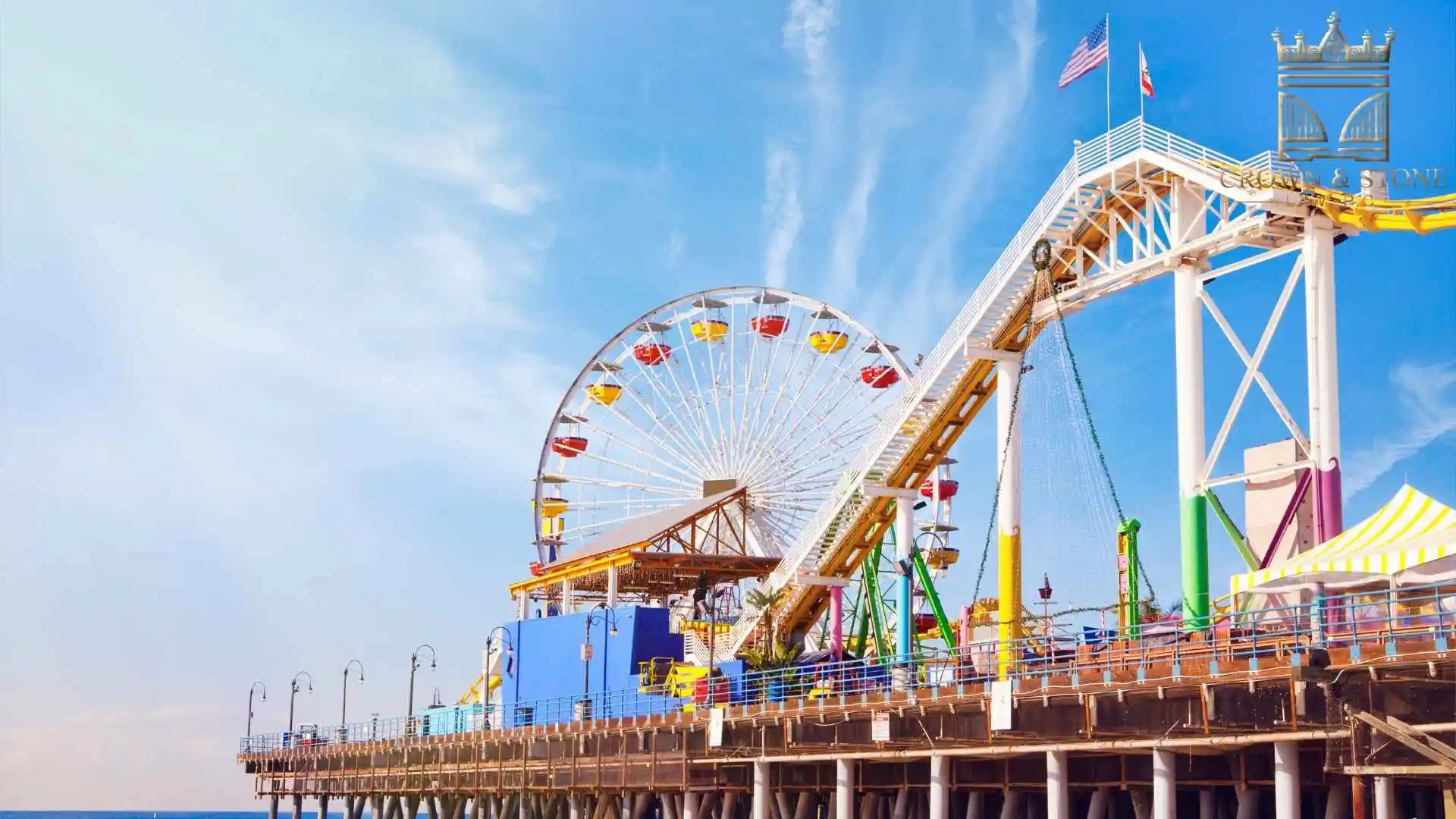 Colorful Ferris wheel and roller coaster on pier in santa monica california
