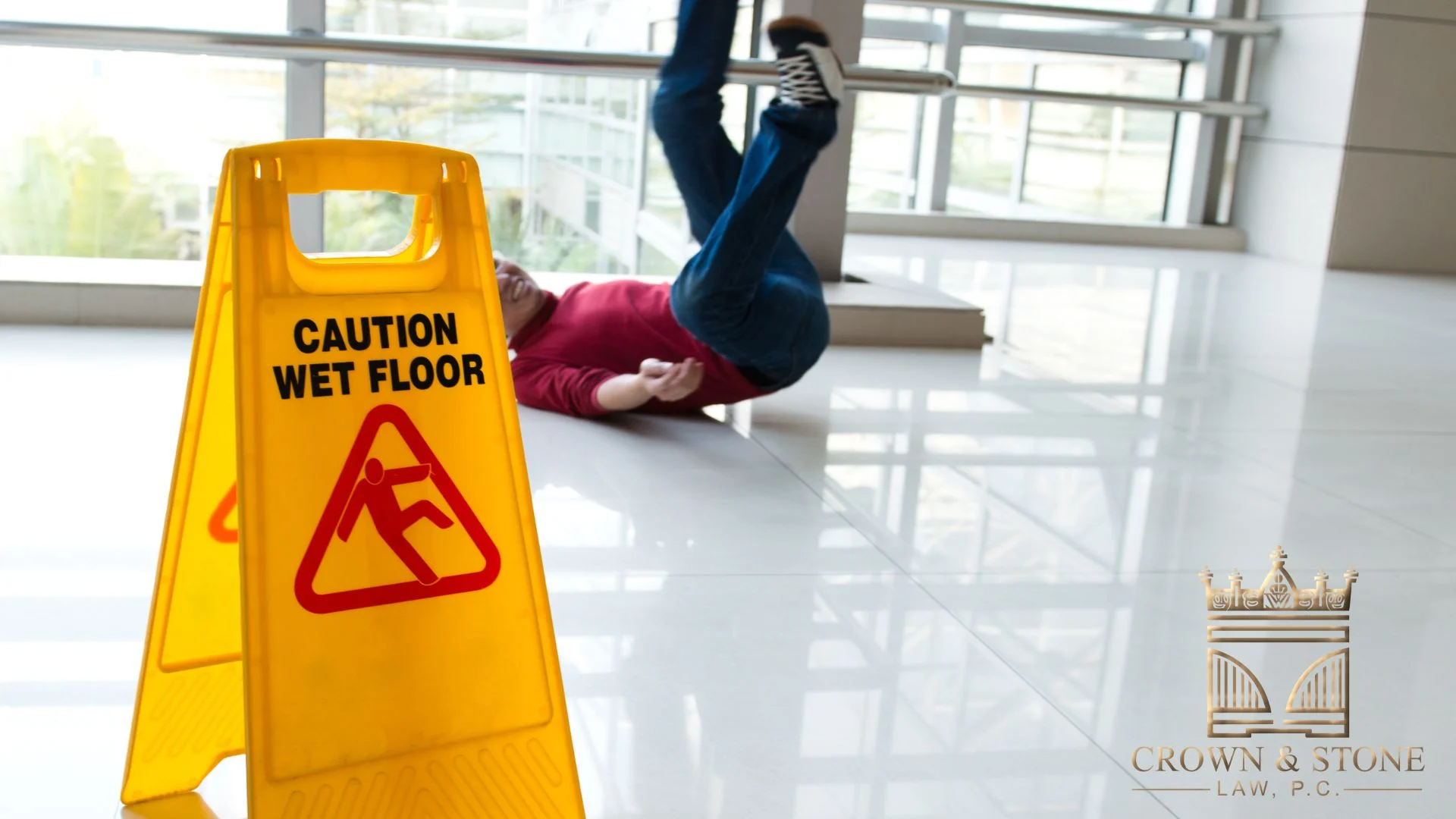 Person slipping near caution wet floor sign