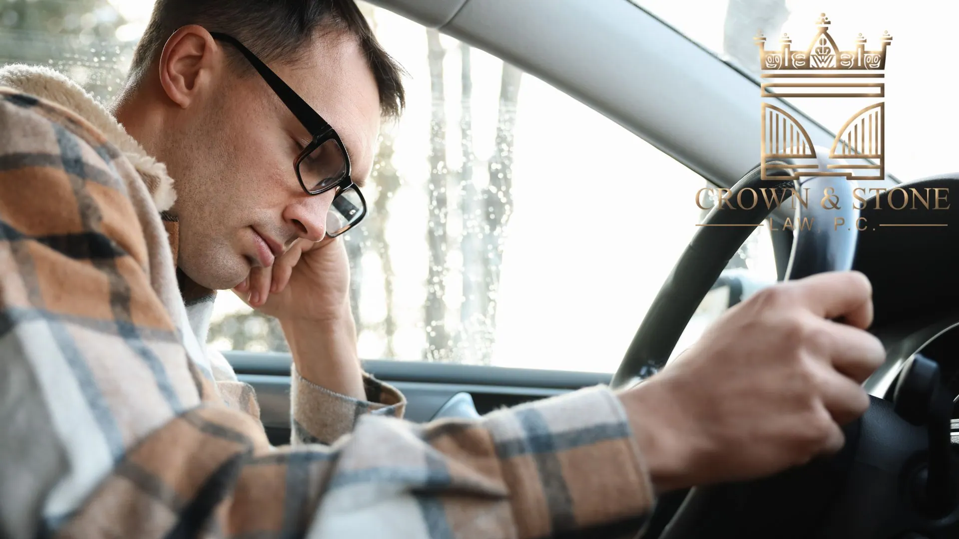 Stressed driver sitting behind steering wheel