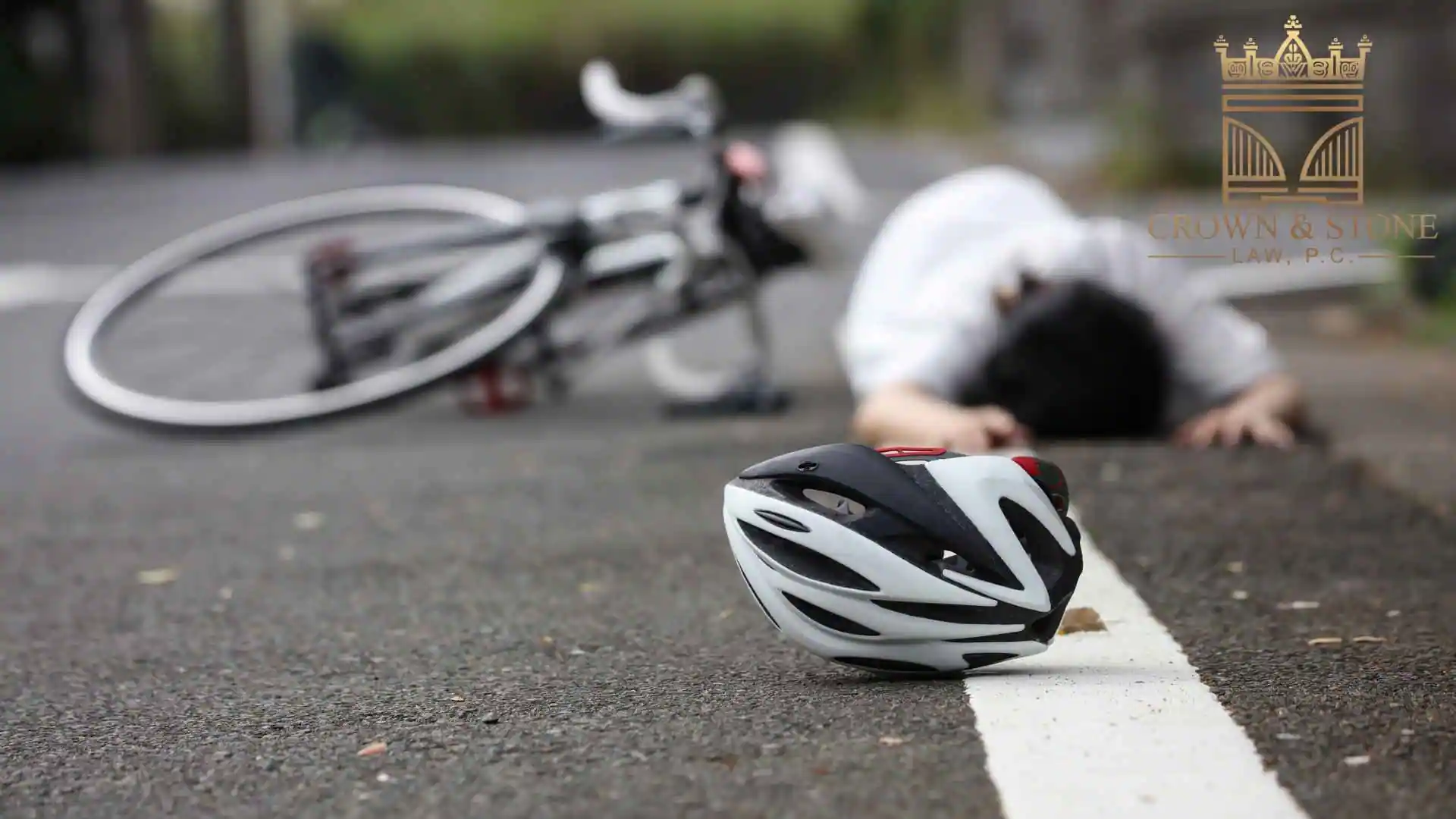 Helmet beside injured cyclist Bicycle Accident Lawyer in West Hollywood